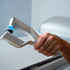 White handheld reflex stimulator held near a surface with blue head pad