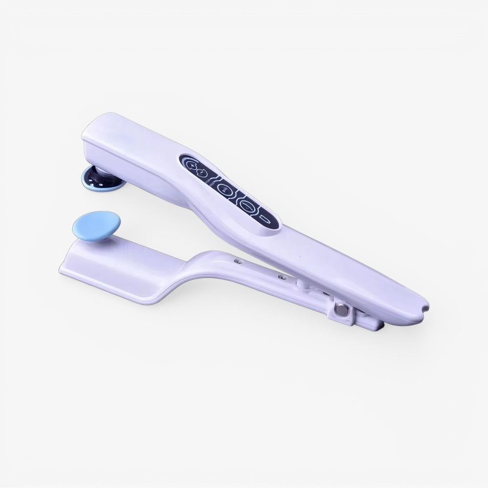 White handheld reflex stimulator with blue accessory pad and dark patterned control strip