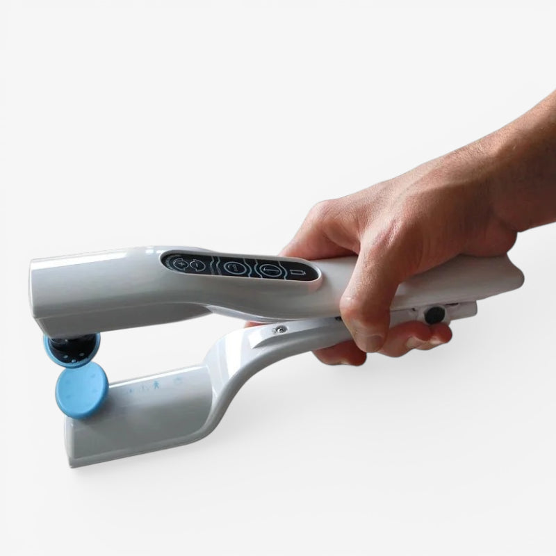 White handheld reflex stimulator with blue suction-like pad and patterned touch area